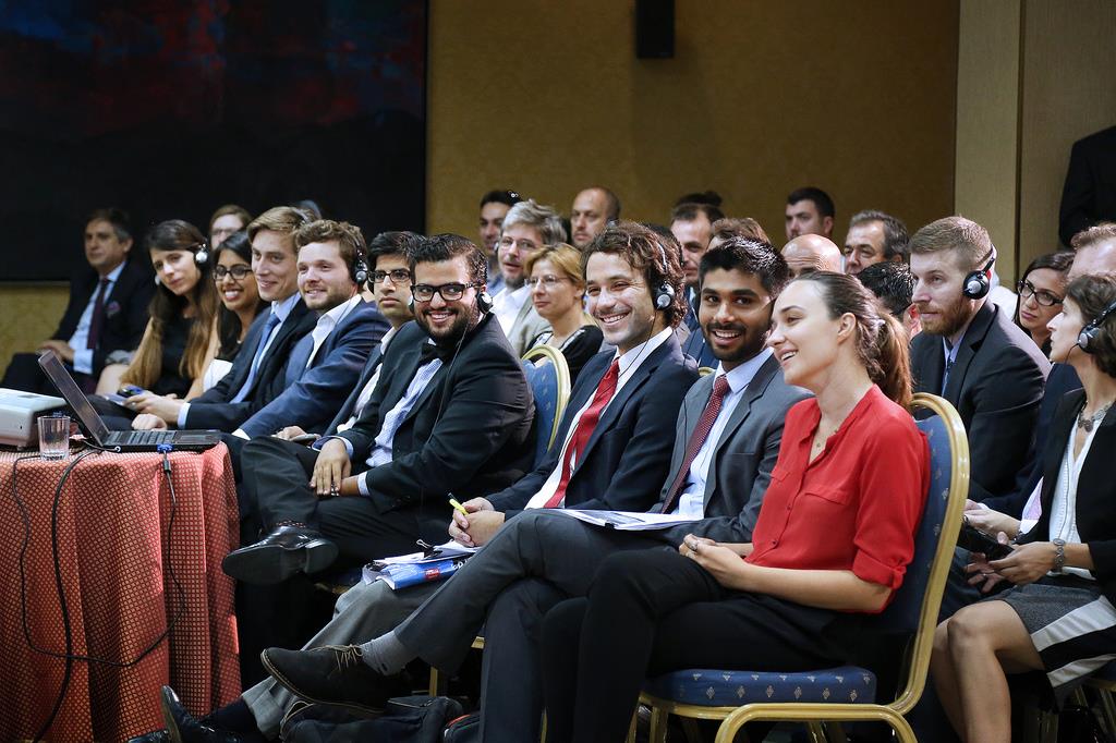 Growth Lab interns and fellows in crowd at conference