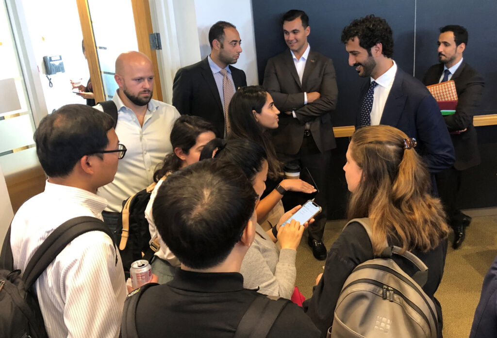 Students crowd around UAE's Minister of Economy