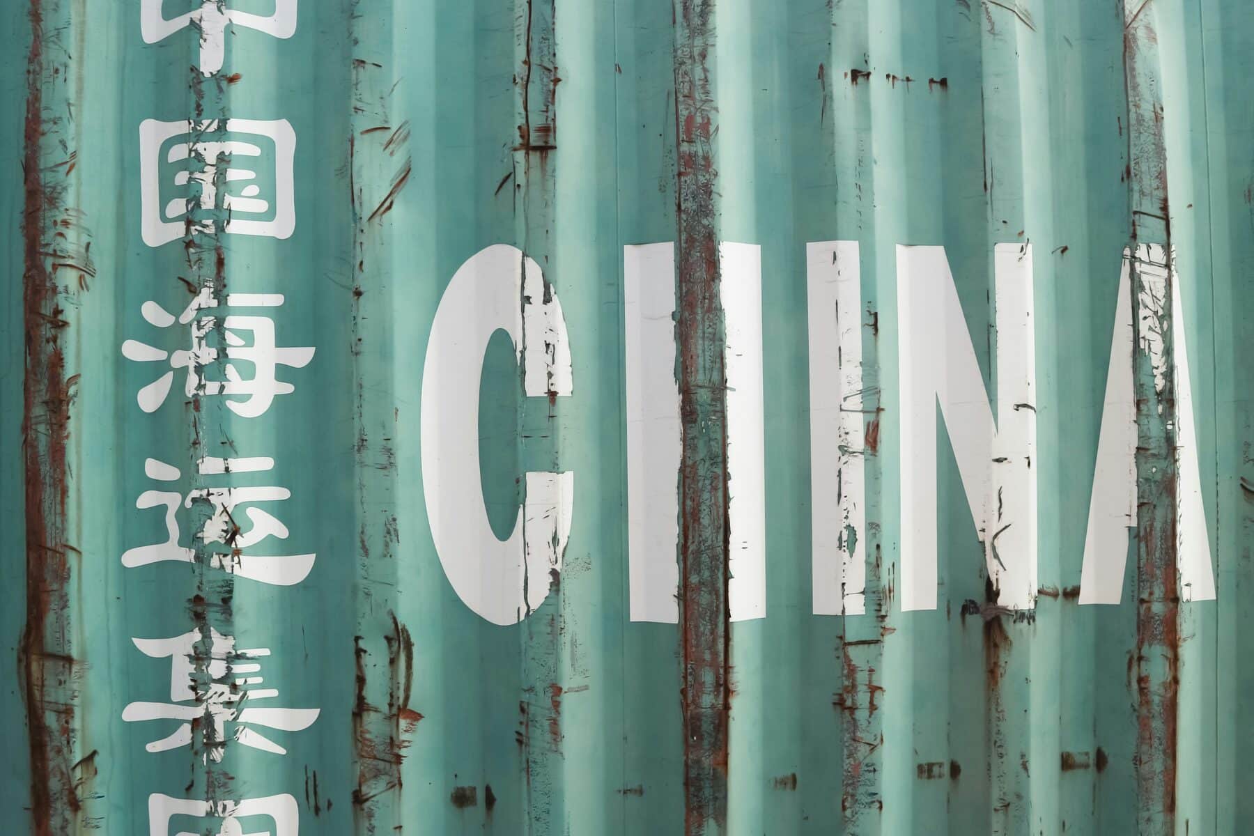 A shipping container with the word, "China" in white letters.